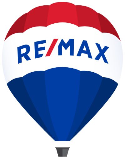 Ein Ballon mit dem Schriftzug des Immobilienmaklernetzwerks RE/MAX ist zu sehen.